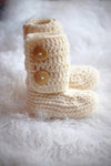 Handmade cream booties with wooden buttons